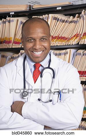 African American male doctor with arms crossed View Large Photo Image Stock Image - African American male doctor with arms crossed. Fotosearch