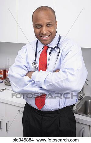 Picture - African American male medical professional wearing stethoscope. Fotosearch