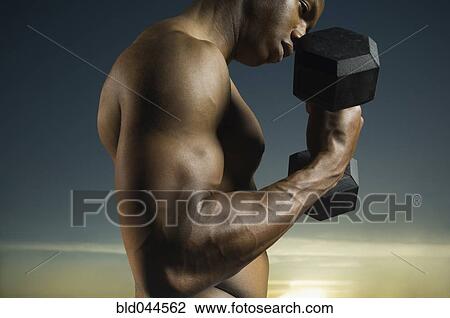 African American man lifting weights View Large Photo Image Stock Image - African American man lifting weights. Fotosearch