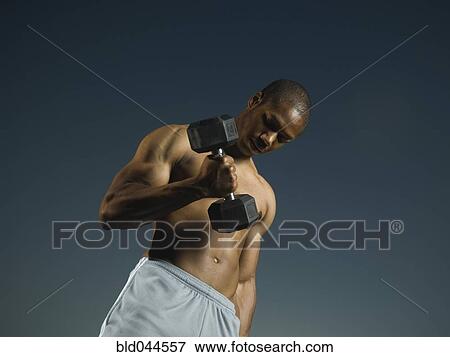 African American man lifting weights View Large Photo Image Stock Photo - African American man lifting weights. Fotosearch