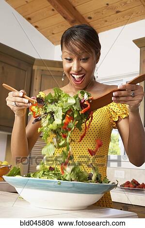 African American woman tossing salad View Large Photo Image Stock Photo - African American woman tossing salad. Fotosearch