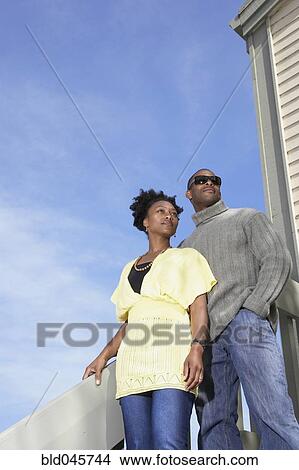 Picture - African couple under blue sky. Fotosearch