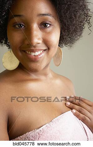 Stock Photo - African woman wrapped in towel. Fotosearch