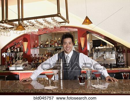 Asian male bartender and cocktails View Large Photo Image Stock Photo - Asian male bartender and cocktails. Fotosearch