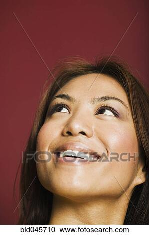Asian woman looking up View Large Photo Image Stock Image - Asian woman looking up. Fotosearch