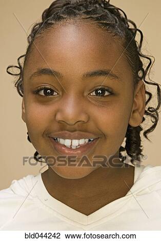 Close up of African American girl smiling View Large Photo Image Stock Image - Close up of African American girl smiling. Fotosearch