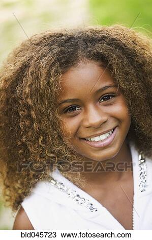 Close up of African American girl smiling View Large Photo Image Stock Image - Close up of African American girl smiling. Fotosearch