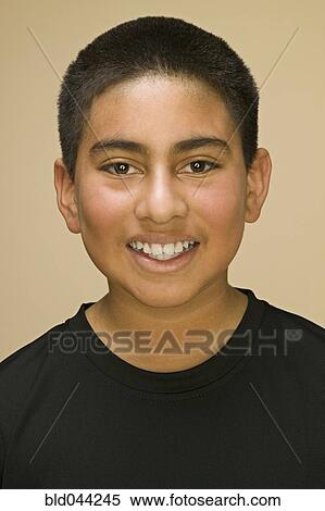 Stock Photography - Close up of Hispanic boy smiling. Fotosearch