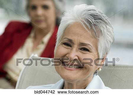 Stock Image - Close up of senior Hispanic woman smiling. Fotosearch