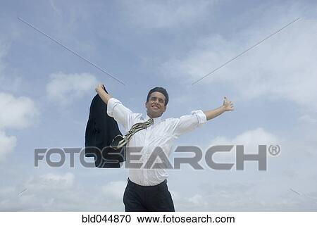 Hispanic businessman with arms raised View Large Photo Image Stock Image - Hispanic businessman with arms raised. Fotosearch