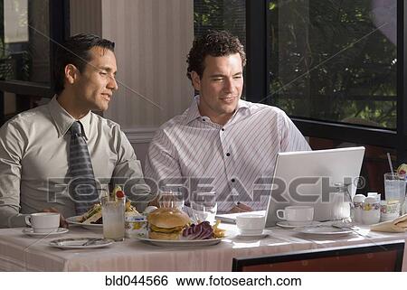Hispanic businessmen at restaurant View Large Photo Image Stock Photograph - Hispanic businessmen at restaurant. Fotosearch