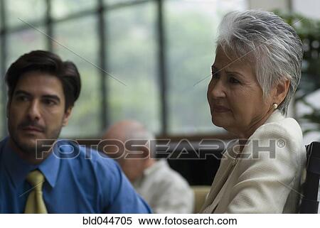Stock Photography - Hispanic businesspeople at meeting. Fotosearch