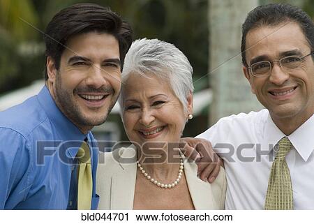 Stock Image - Hispanic businesspeople laughing. Fotosearch