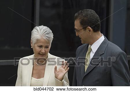 Hispanic businesspeople talking View Large Photo Image Stock Image - Hispanic businesspeople talking. Fotosearch