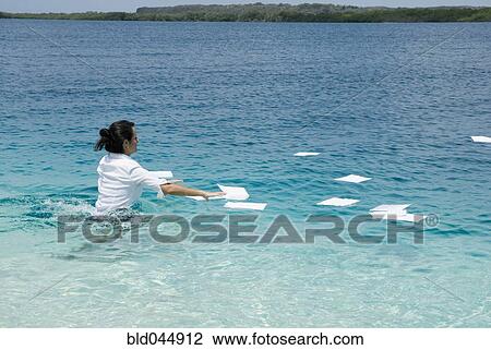 Hispanic businesswoman in water with paperwork View Large Photo Image Stock Image - Hispanic businesswoman in water with paperwork. Fotosearch