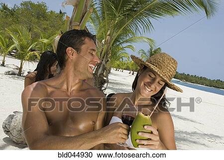 Stock Image - Hispanic couple at beach. Fotosearch