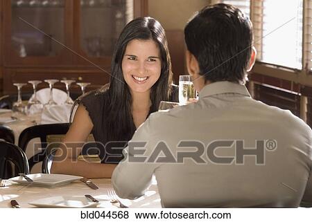Stock Photo - Hispanic couple at restaurant. Fotosearch
