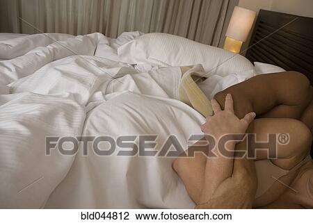 Hispanic couple hugging in bed View Large Photo Image Stock Image - Hispanic couple hugging in bed. Fotosearch
