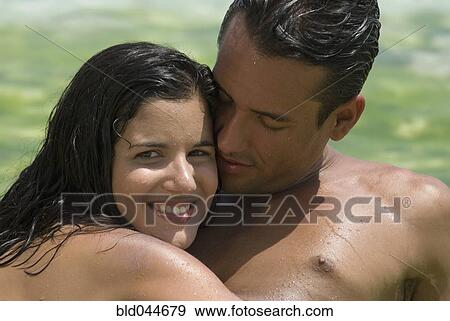 Hispanic couple hugging View Large Photo Image Stock Photo - Hispanic couple hugging. Fotosearch