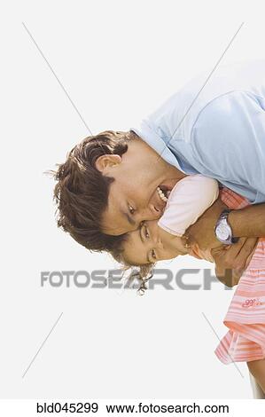 Hispanic father hugging daughter View Large Photo Image Stock Photo - Hispanic father hugging daughter. Fotosearch