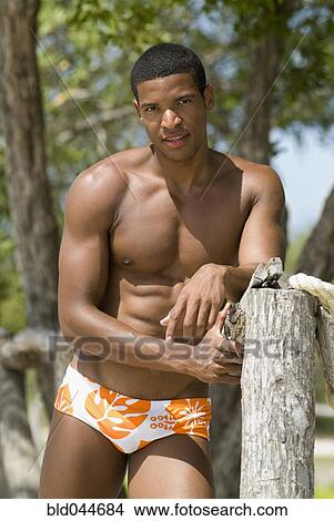 Hispanic man wearing bathing suit View Large Photo Image Picture - Hispanic man wearing bathing suit. Fotosearch