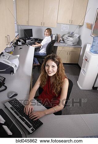 Stock Image - Hispanic medical professionals in office. Fotosearch