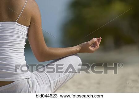 Hispanic woman meditating View Large Photo Image Stock Image - Hispanic woman meditating. Fotosearch