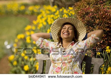 Hispanic woman wearing sun hat View Large Photo Image Stock Image - Hispanic woman wearing sun hat. Fotosearch