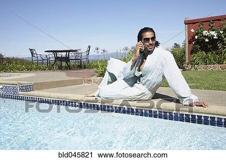 Stock Image - Indian man talking on cell phone. Fotosearch