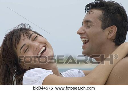 Multi-ethnic couple laughing View Large Photo Image Stock Photography - Multi-ethnic couple laughing. Fotosearch