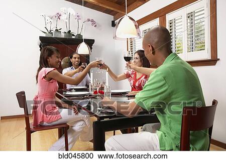 Multi-ethnic couples at dinner party View Large Photo Image Stock Image - Multi-ethnic couples at dinner party. Fotosearch