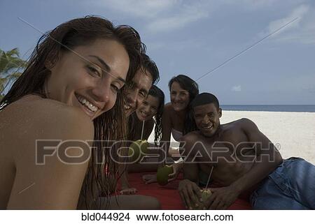 Multi-ethnic friends at beach View Large Photo Image Picture - Multi-ethnic friends at beach. Fotosearch