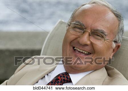 Stock Image - Senior Hispanic man laughing. Fotosearch