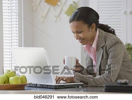 African American businesswoman looking at laptop View Large Photo Image Stock Image - African American businesswoman looking at laptop. Fotosearch