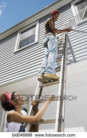 African American couple replacing window screens View Large Photo Image Stock Photo - African American couple replacing window screens. Fotosearch