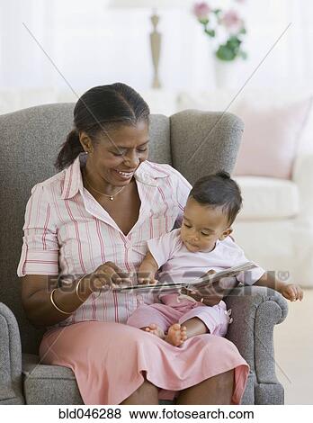 African American grandmother reading to baby View Large Photo Image Stock Photo - African American grandmother reading to baby. Fotosearch