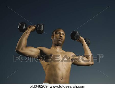 African American man lifting weights View Large Photo Image Stock Photo - African American man lifting weights. Fotosearch