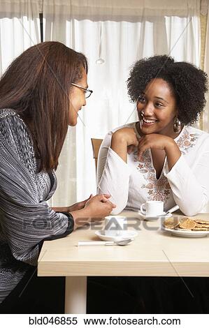 African American mother and daughter talking View Large Photo Image Stock Photography - African American mother and daughter talking. Fotosearch