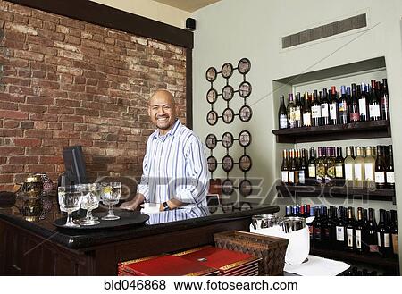 Stock Photo - Asian man working at restaurant. Fotosearch