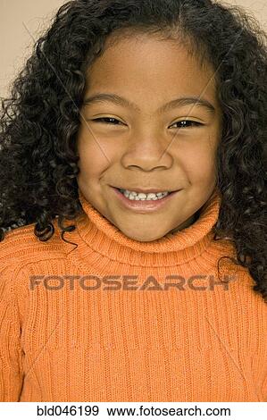 Stock Photograph of Pacific Islander girl with curly hair bld046199 ...