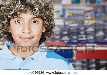 Stock Photograph - Close up of Hispanic boy smiling. Fotosearch