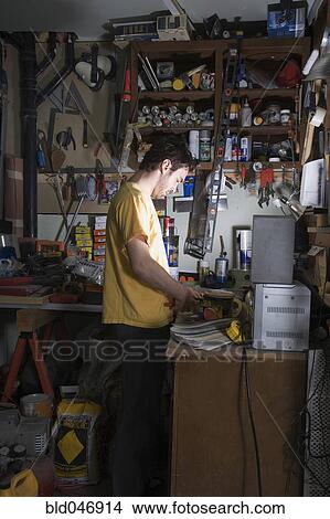 Middle Eastern man in home workshop View Large Photo Image Picture - Middle Eastern man in home workshop. Fotosearch