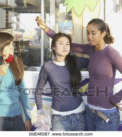 Stock Photo - Multi-ethnic girls at carnival. Fotosearch