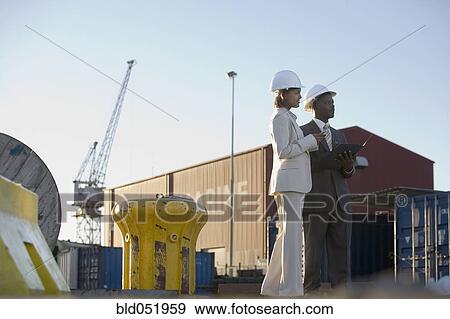 African American businesspeople at commercial pier View Large Photo Image Stock Photo - African American businesspeople at commercial pier. Fotosearch
