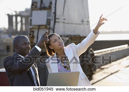African American businesspeople pointing up View Large Photo Image Stock Photography - African American businesspeople pointing up. Fotosearch