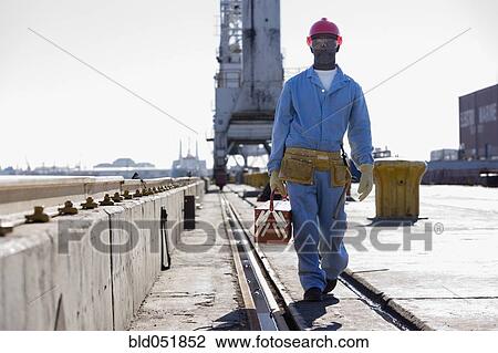African American male construction worker carrying toolbox View Large Photo Image Stock Image - African American male construction worker carrying toolbox. Fotosearch