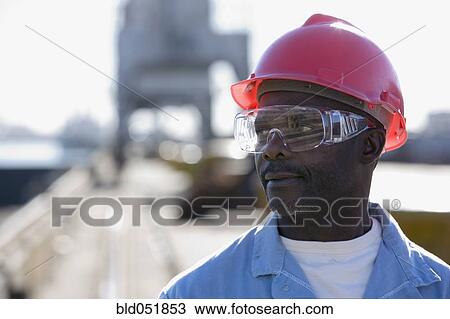 African American male construction worker wearing hardhat View Large Photo Image Stock Image - African American male construction worker wearing hardhat. Fotosearch