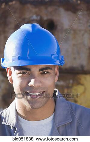 Stock Photo - African American male construction worker wearing hardhat. Fotosearch
