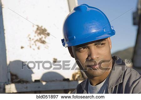 African American male construction worker wearing hardhat View Large Photo Image Stock Photo - African American male construction worker wearing hardhat. Fotosearch