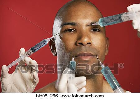African American man receiving injections in face View Large Photo Image Stock Photograph - African American man receiving injections in face. Fotosearch